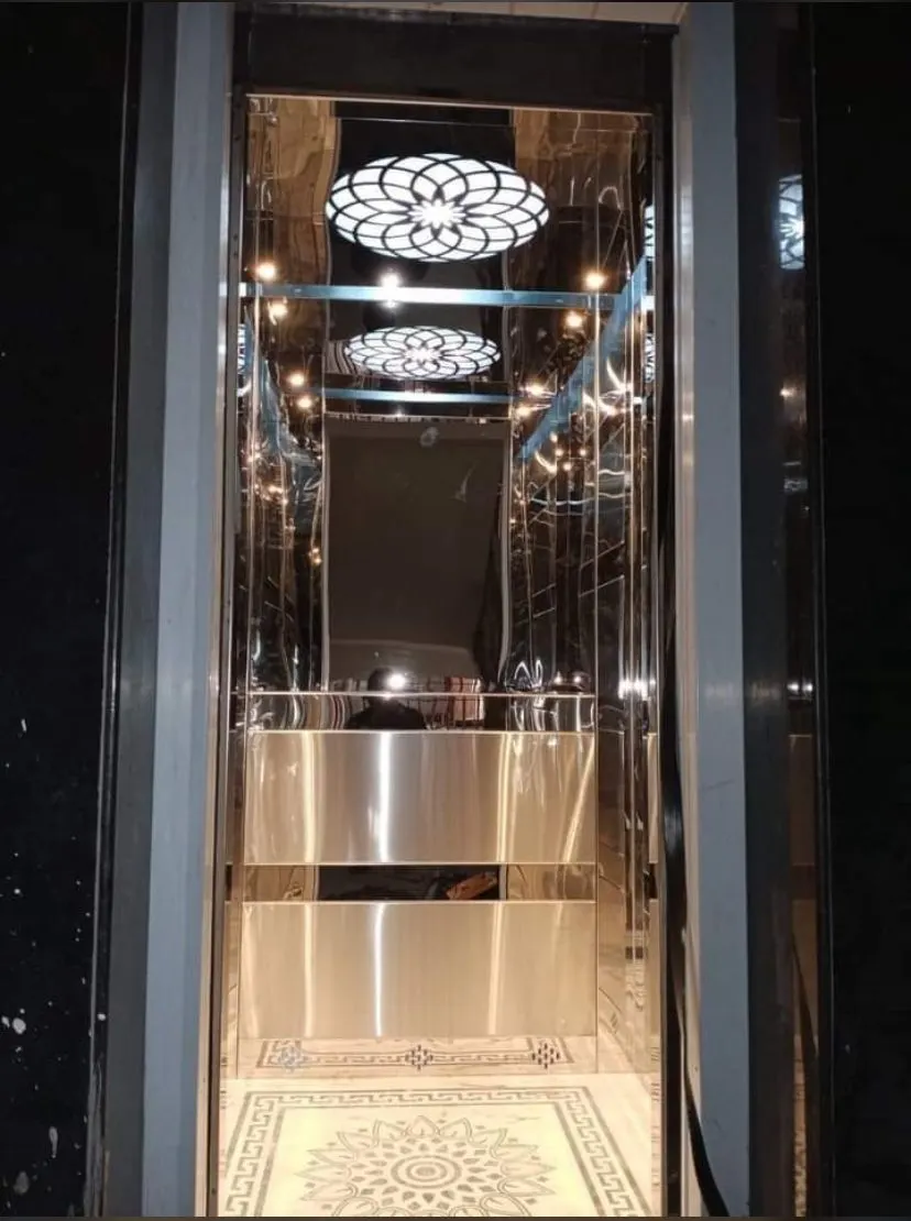 Mirror-gold residential cabin with a patterned designer ceiling light